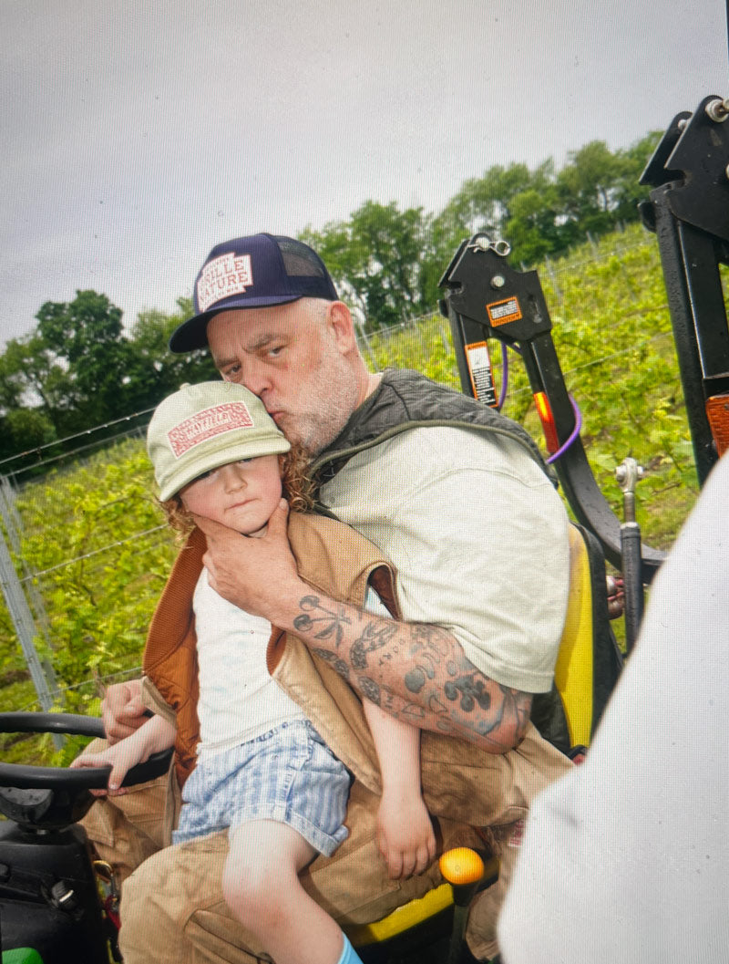 Man and child on a tractor