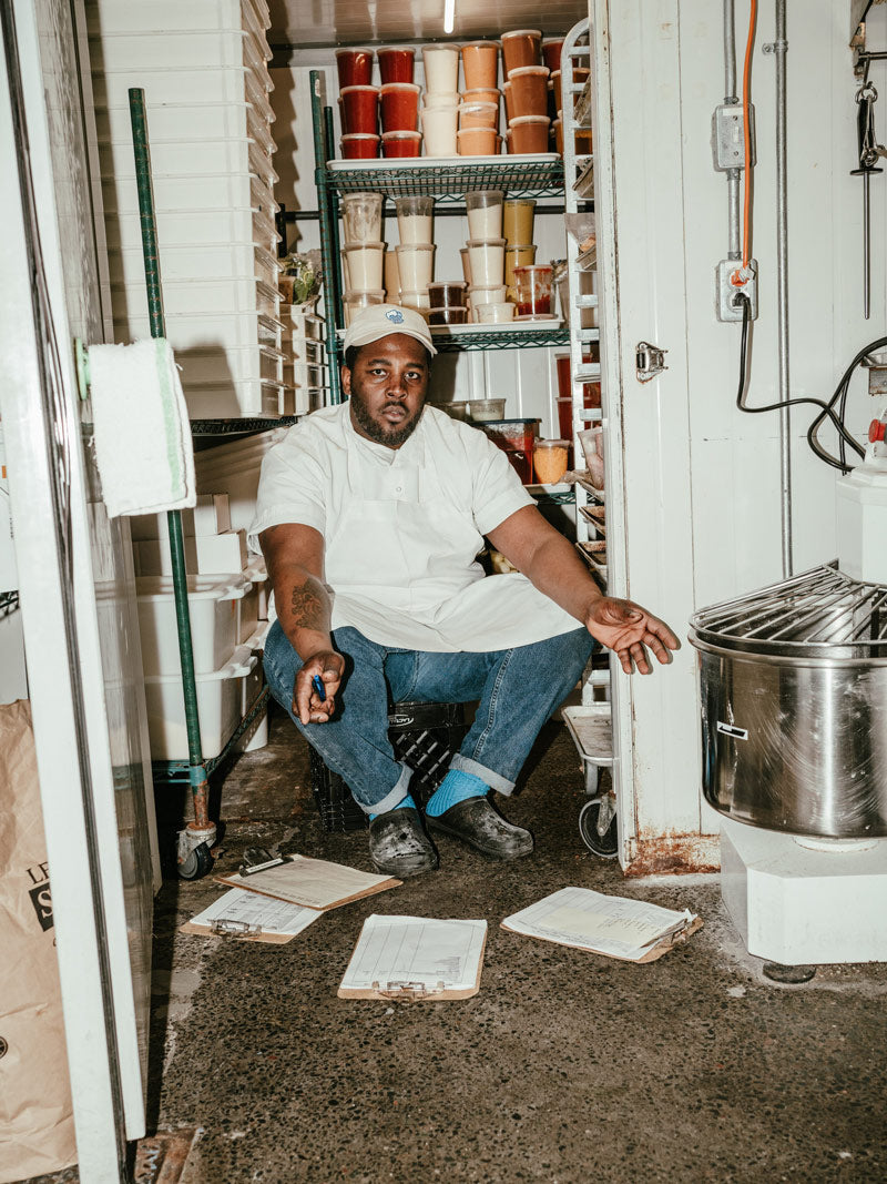 Man wearing Kamik Nova clogs during kitchen work shift