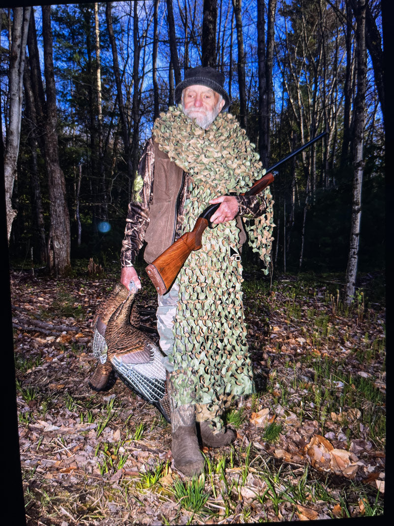 Man in hunting gear wearing Kamik Fld Day camouflage boots